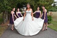 Bridemates Holding Bride's Gown